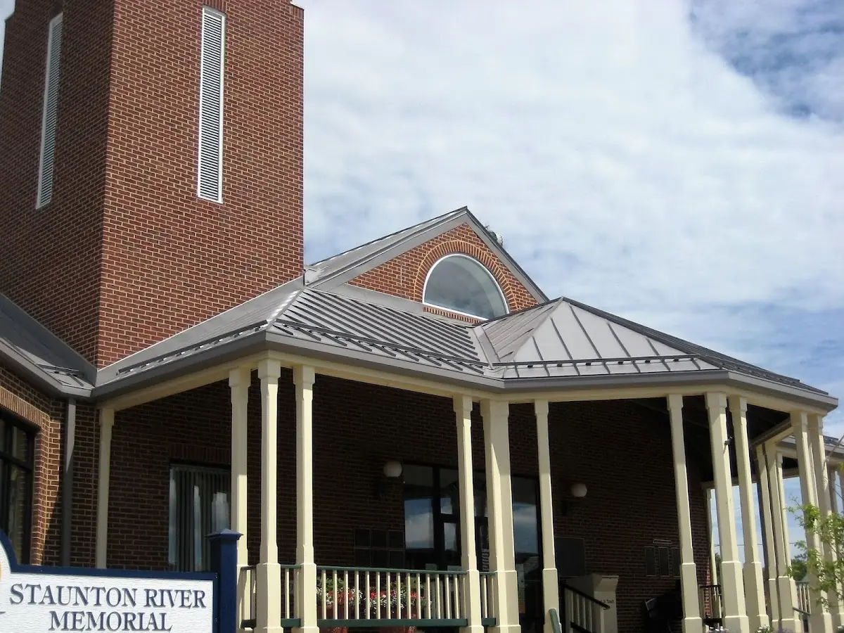 Skilled roofing craftsmen working on a residential roof in Barre